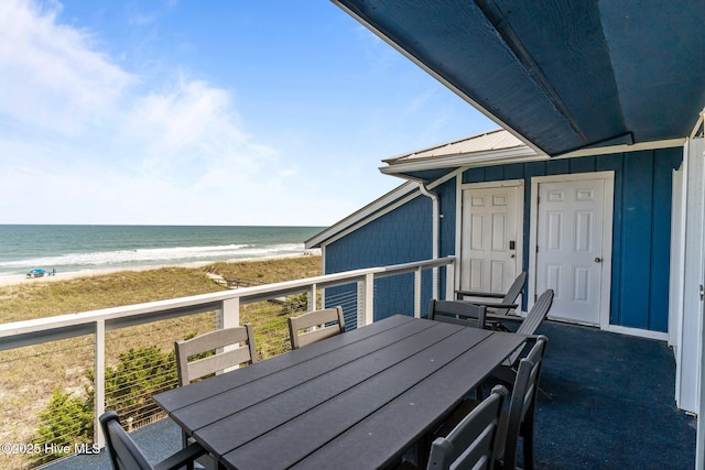608 Carolina Beach Ave N Unit 3C, Carolina Beach, NC 28428 - balcony featuring outdoor dining area and view of water and beach