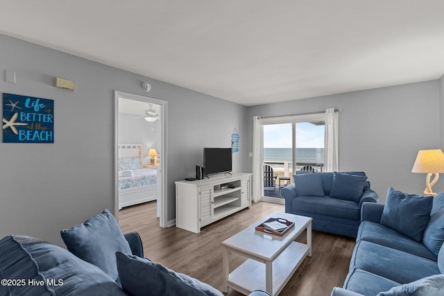 608 Carolina Beach Ave N Unit 3C, Carolina Beach, NC 28428 - living area featuring wood finished floors and ceiling fan