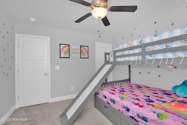 carpeted bedroom with baseboards and ceiling fan