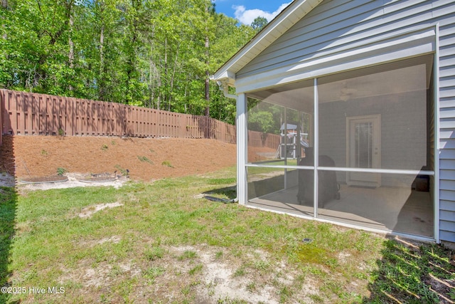 view of yard with a sunroom