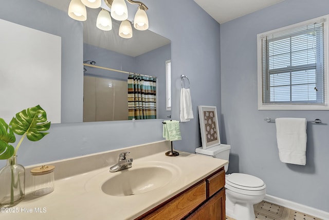 100 Sycamore Ln, Elizabeth City, NC 27909 - bathroom with baseboards, vanity, a shower with curtain, toilet, and a chandelier