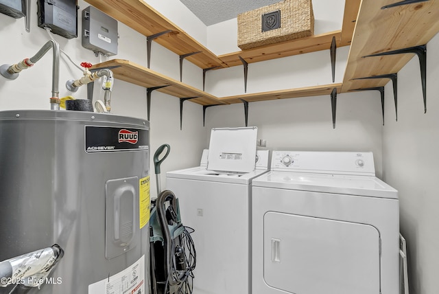 100 Sycamore Ln, Elizabeth City, NC 27909 - laundry room featuring electric water heater and washing machine and clothes dryer