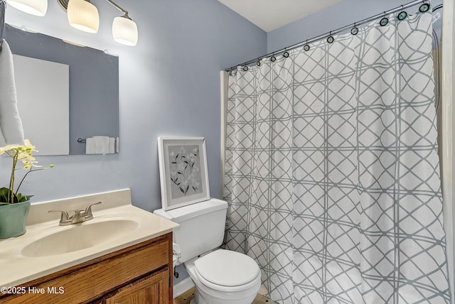 100 Sycamore Ln, Elizabeth City, NC 27909 - full bathroom featuring toilet, vanity, and a shower with shower curtain
