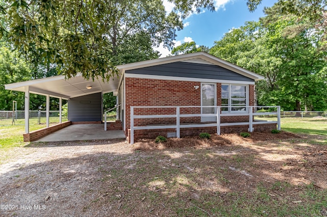 204 Fox Dr, Dudley, NC 28333 - view of front of home featuring brick siding, fence, and driveway
