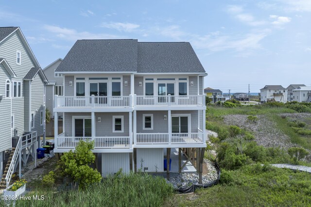 130 Sea Oaks Ct, North Topsail Beach, NC 28460 - back of property with a shingled roof and a balcony