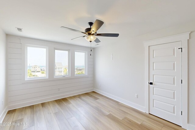 130 Sea Oaks Ct, North Topsail Beach, NC 28460 - unfurnished room with baseboards, light wood-type flooring, and a ceiling fan