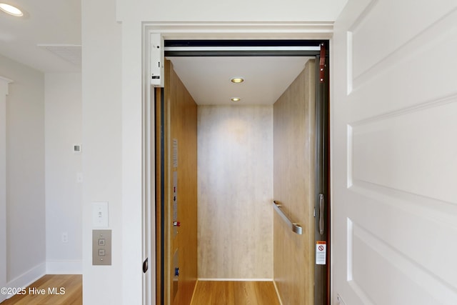130 Sea Oaks Ct, North Topsail Beach, NC 28460 - elevator with wood finished floors, recessed lighting, and baseboards