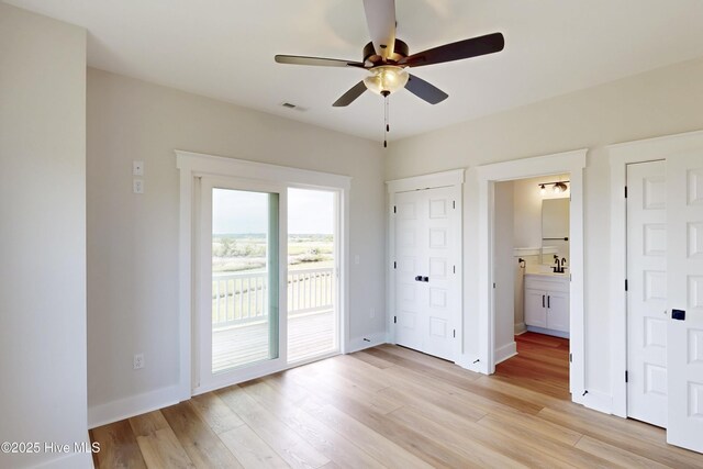 130 Sea Oaks Ct, North Topsail Beach, NC 28460 - unfurnished bedroom featuring access to outside, light wood-style floors, and baseboards