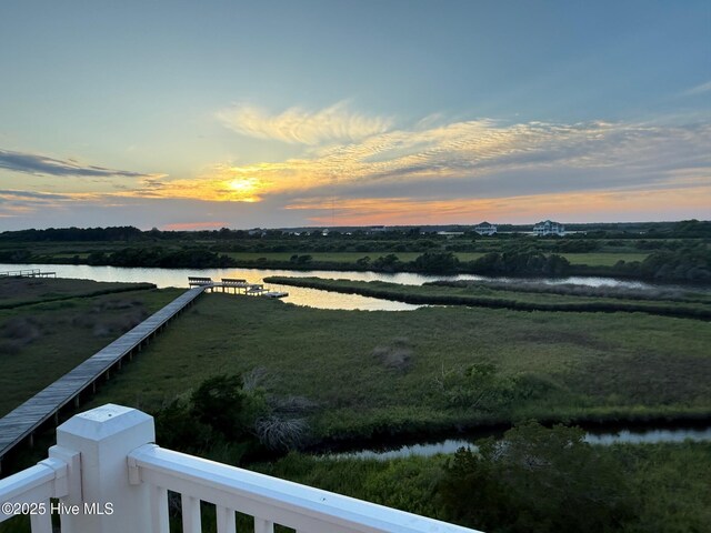 130 Sea Oaks Ct, North Topsail Beach, NC 28460 - yard at dusk featuring a water view