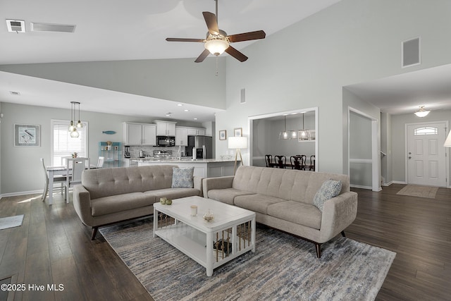 7810 Olde Pond Rd, Wilmington, NC 28411 - living room with a ceiling fan, dark wood finished floors, baseboards, and high vaulted ceiling