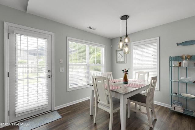 7810 Olde Pond Rd, Wilmington, NC 28411 - dining room with dark wood-type flooring and baseboards
