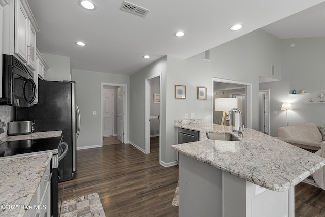 7810 Olde Pond Rd, Wilmington, NC 28411 - kitchen with black microwave, electric range, a sink, dark wood-style floors, and a peninsula