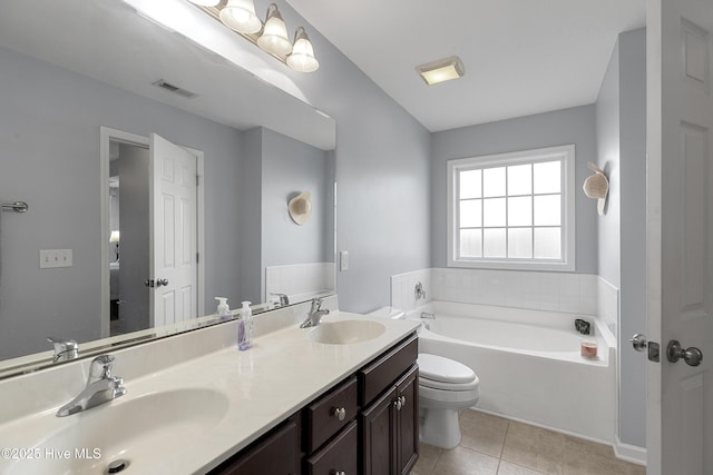 7810 Olde Pond Rd, Wilmington, NC 28411 - full bathroom featuring a garden tub, tile patterned floors, ensuite bathroom, toilet, and double vanity