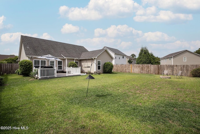 7810 Olde Pond Rd, Wilmington, NC 28411 - back of house with a fire pit, roof with shingles, and a deck