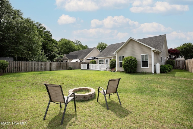 7810 Olde Pond Rd, Wilmington, NC 28411 - rear view of property with central air condition unit, an outdoor fire pit, and roof with shingles