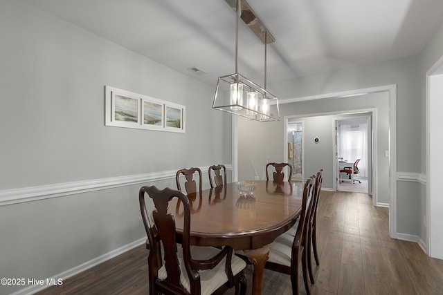7810 Olde Pond Rd, Wilmington, NC 28411 - dining area featuring dark wood-style flooring, baseboards, and a chandelier
