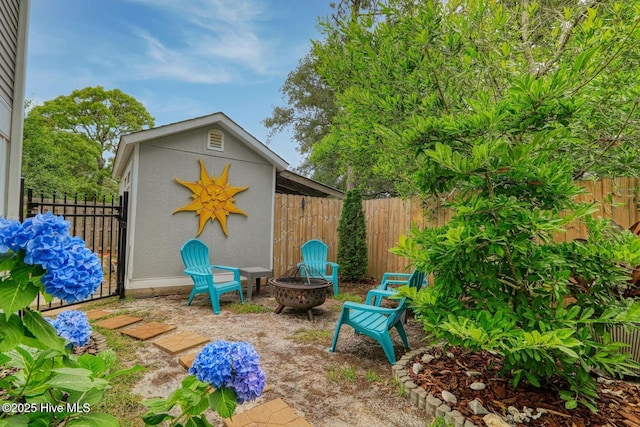 129 NE 36th St, Oak Island, NC 28465 - fenced backyard with a fire pit