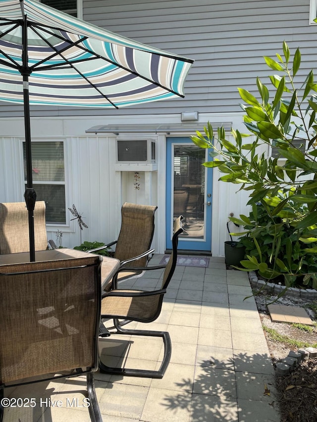 129 NE 36th St, Oak Island, NC 28465 - view of patio / terrace featuring outdoor dining space