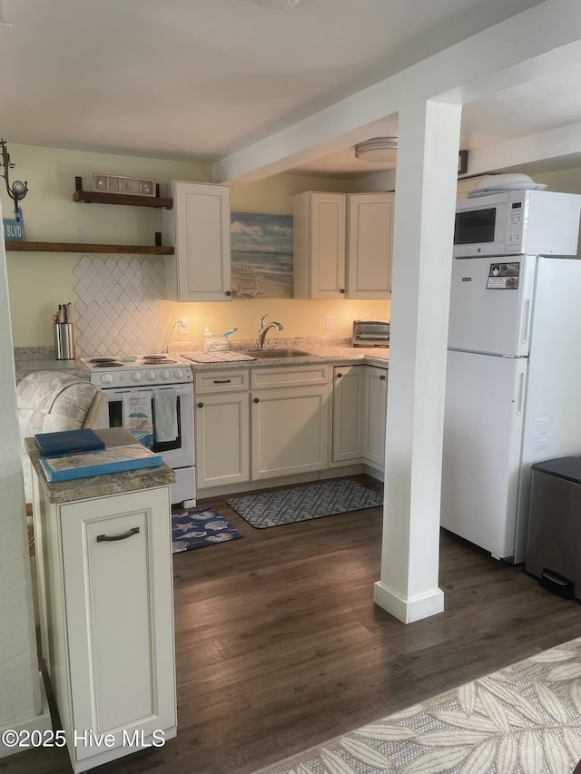 129 NE 36th St, Oak Island, NC 28465 - kitchen featuring white appliances, dark wood-style floors, open shelves, and decorative backsplash