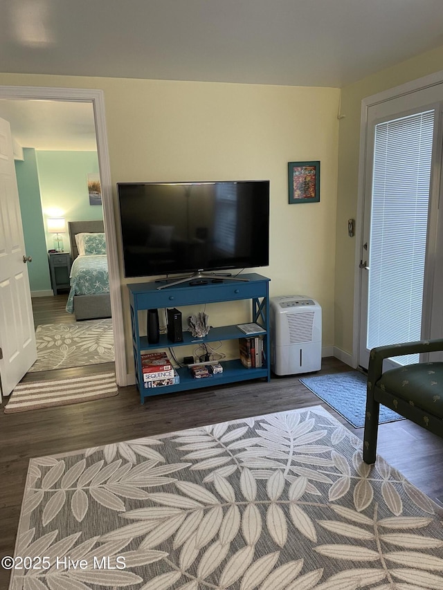 129 NE 36th St, Oak Island, NC 28465 - living area featuring wood finished floors and baseboards