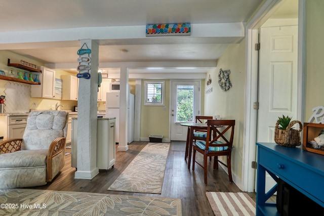 129 NE 36th St, Oak Island, NC 28465 - foyer featuring dark wood-style floors and baseboards