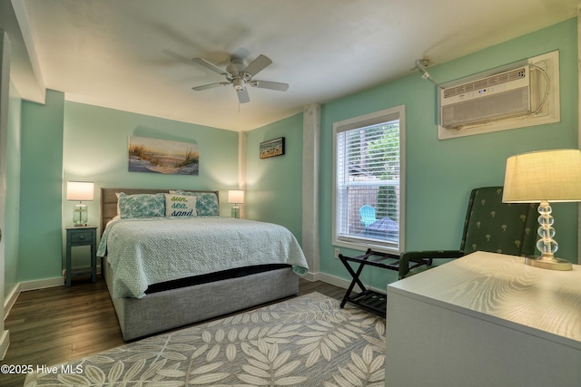 129 NE 36th St, Oak Island, NC 28465 - bedroom featuring wood finished floors, baseboards, and a ceiling fan