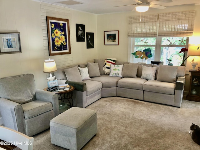129 NE 36th St, Oak Island, NC 28465 - carpeted living area featuring ceiling fan and crown molding