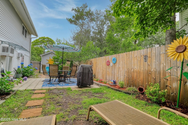 129 NE 36th St, Oak Island, NC 28465 - fenced backyard with a patio