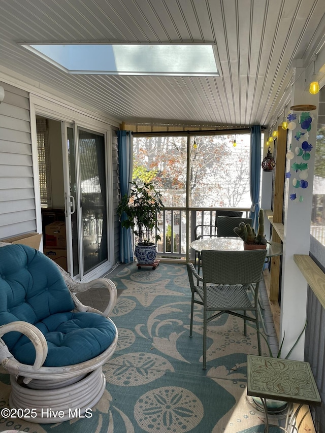 129 NE 36th St, Oak Island, NC 28465 - sunroom / solarium with a skylight, plenty of natural light, and wood ceiling