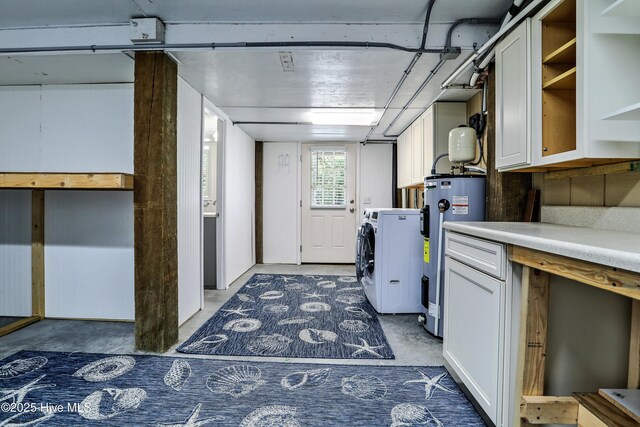 129 NE 36th St, Oak Island, NC 28465 - washroom featuring electric water heater and washing machine and dryer