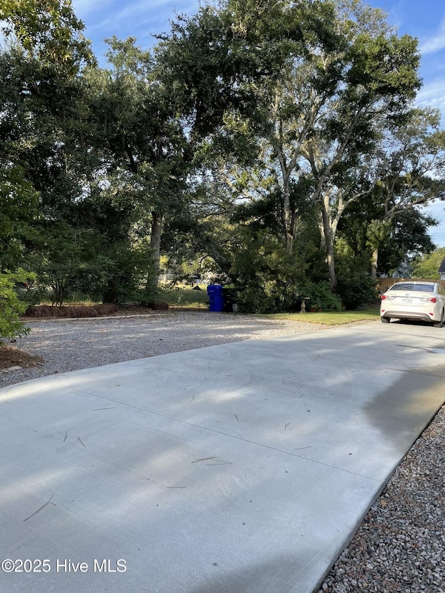 129 NE 36th St, Oak Island, NC 28465 - view of yard with concrete driveway
