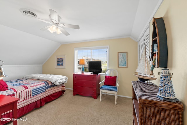 carpeted bedroom with lofted ceiling, baseboards, and a ceiling fan