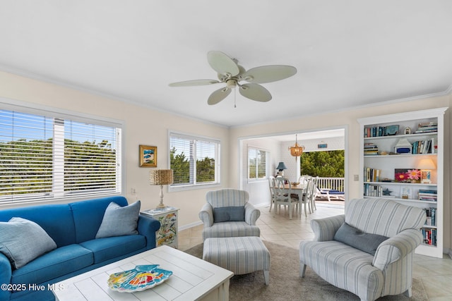 living room featuring ceiling fan, light tile patterned floors, and ornamental molding