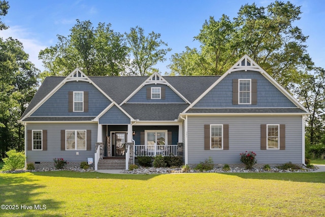 view of front facade with covered porch, a front yard, crawl space, and roof with shingles