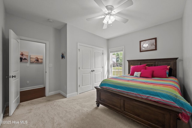 bedroom featuring a closet, carpet, baseboards, and a ceiling fan
