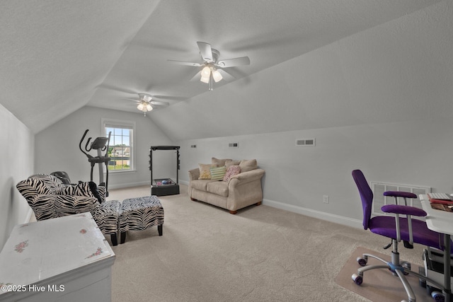 home office featuring carpet flooring, lofted ceiling, ceiling fan, baseboards, and a textured ceiling