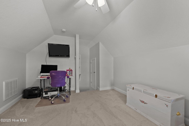 home office featuring lofted ceiling, carpet flooring, baseboards, and ceiling fan