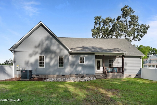 rear view of property with crawl space, central AC, covered porch, and a shingled roof