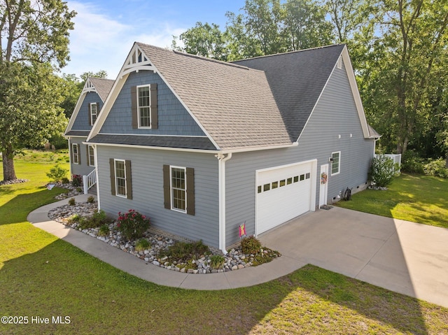 view of front of property with a garage, driveway, a front yard, and a shingled roof