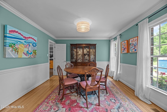 1005 Cambridge Ct, Trent Woods, NC 28562 - dining room with wood finished floors, healthy amount of natural light, wainscoting, and ornamental molding