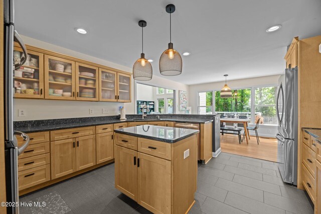 1005 Cambridge Ct, Trent Woods, NC 28562 - kitchen with freestanding refrigerator, a peninsula, a sink, recessed lighting, and dark tile patterned flooring