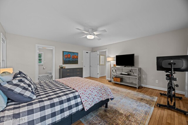 1005 Cambridge Ct, Trent Woods, NC 28562 - bedroom with baseboards, light wood-style floors, ceiling fan, and ensuite bath