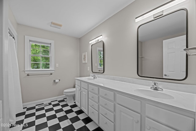 1005 Cambridge Ct, Trent Woods, NC 28562 - full bath with tile patterned floors, toilet, double vanity, and baseboards