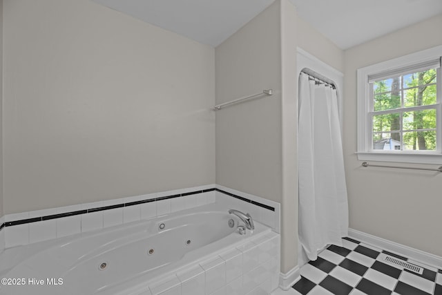 1005 Cambridge Ct, Trent Woods, NC 28562 - bathroom with a jetted tub, baseboards, and tile patterned floors