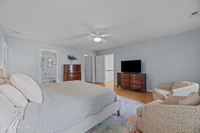 1005 Cambridge Ct, Trent Woods, NC 28562 - bedroom with light wood finished floors, baseboards, a ceiling fan, and ensuite bathroom