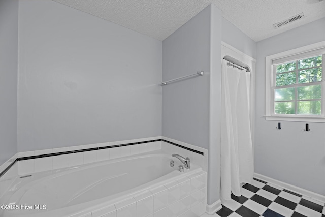 1005 Cambridge Ct, Trent Woods, NC 28562 - bathroom with tile patterned floors, a textured ceiling, a garden tub, and curtained shower
