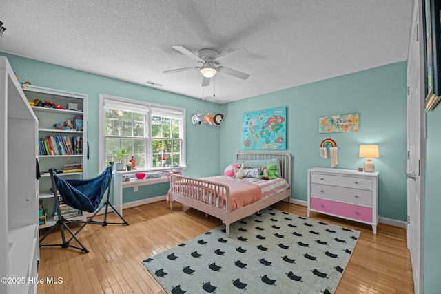 1005 Cambridge Ct, Trent Woods, NC 28562 - bedroom with hardwood / wood-style flooring, a textured ceiling, baseboards, and ceiling fan