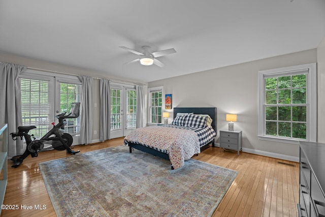 1005 Cambridge Ct, Trent Woods, NC 28562 - bedroom with access to outside, multiple windows, light wood-style floors, and baseboards