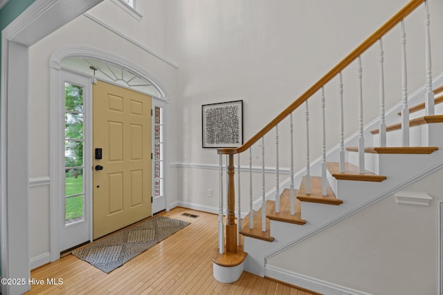 1005 Cambridge Ct, Trent Woods, NC 28562 - foyer entrance with hardwood / wood-style floors, stairway, baseboards, and a high ceiling