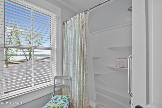 bathroom featuring a shower with curtain, a water view, and crown molding